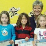 Cate Brown, Jasper Nespecca and Mazzie Powell are pre-kindergarten students at Polk Central School who are very proud to receive the Terrific Kid award from their teachers. They are shown with Principal Ms. Dottie Kinlaw. (photo submitted)