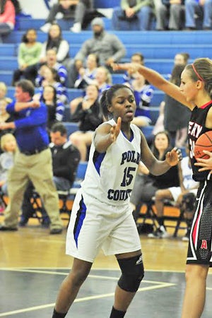 Janada Carson trying to take ball from an Avery player, who lightly clapped Carson’s face, just after these photos were taken. For that, officials awarded Polk the ball. (photo by Mark Schmerling)