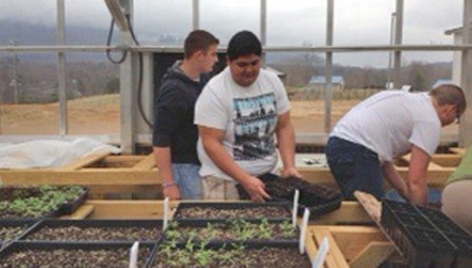 Polk County High School students work in their garden. (photo submitted by Susan MCNabb)