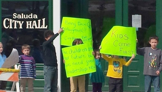 Children in Saluda picketed the city last week after playground equipment was removed from McCreery Park. (photo submitted by Ellen Rogers) 