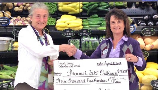 Carol Newton, Outreach Executive Director (Left), Donna Ducker, Food Lion Manager (Right)