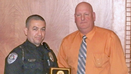 Columbus Officer Ron Diaz and police chief Chris Beddingfield 