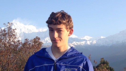Morgan Pratt wearing his Wolverines jacket in Nepal. (photo submitted by Amy Pratt)