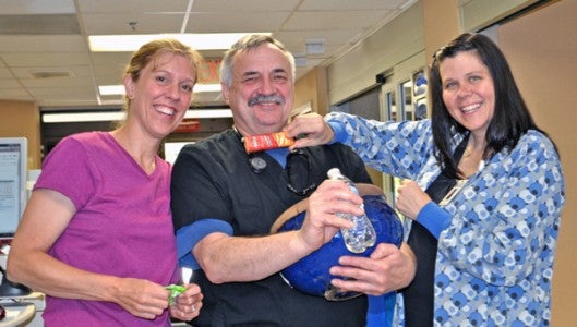 Lori Oliver, ED nurse manager, Greg Miner and Melissa Henderson in the Emergency Department 