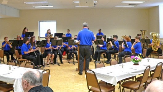 Director Matt Putnam led the Polk County Middle School eighth grade band in several selections to entertain the Lions and their visually impaired guests at a l uncheon held recently at the Tryon First Baptist Church Activities Building. (photo submitted by Roger Gauen)