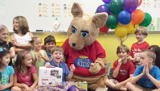 Tryon Elementary School first grader Neil Rostick was surprised on May 1 with a party and gifts from Read-A-Roo, a PBS character who visited to tell Rostick he won this year’s book contest for first graders in the state. Story page 4. (photo submitted by Carolyn Rostick)