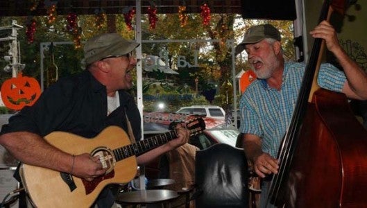 Dog Whistle members Scott Allen on guitar (left) and Stan Halbkat on bass. (Photo by Kirk Gollwitzer)