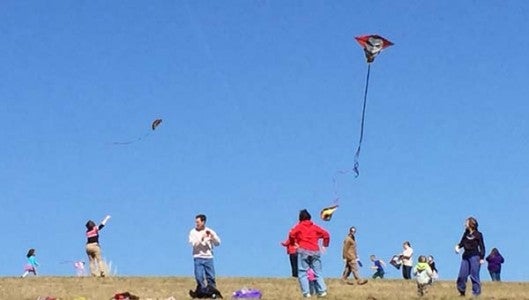 A few hundred children and their parents attended the annual Go Fly A Kite Day at FENCE on Saturday afternoon and sent kites soaring. Free kites were available for the first 200 children. The event was made possible through the Kirby Endowment Fund of Polk County Community Foundation. (Photo by Kevin Powell) 