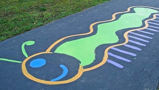 One of several designs painted onto the trail at Brookwood Park in Landrum is this caterpillar designed by Nicholas Price, 13. 