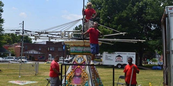 Several crews were on hand Tuesday from ABC Party Rentals and Amusements setting up kids’ rides in advance of the Fabulous 4th celebration to be held Saturday in Columbus. More details on the celebration will be in Friday’s paper, including a schedule of music, vendors and related events. (Photo by Michael O’Hearn)