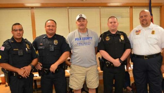 Tryon Town Council recognized local police officers and firefighters who were first on scene to a fatal fire in August that took the life of Trey Miller on East Howard Street. Pictured from left to right are Tryon police officers Manny Zaragoza and Alan Corn, Tryon firefighter Scotty Gosnell, Columbus police officer Nicholas Stott and Tryon firefighter Tank Waters. (Photo by Leah Justice)