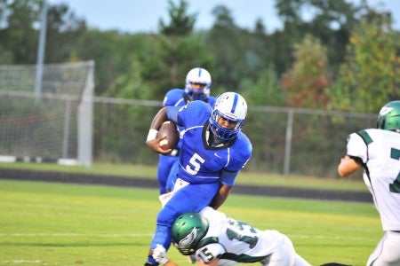 Polk's Khiree Green (#5) gives the Wolverines another dimension in running backs. Green picked up key yardage in the Wolverines' 36-14 win over east Henderson last Friday. (Photo by Mark Schmerling)