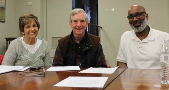 TFAC Exhibits Committee members Frances McCain and Tim Brannon discuss the upcoming exhibit, “Preserving African American Art in the Foothills,” with collector John Wilkins.