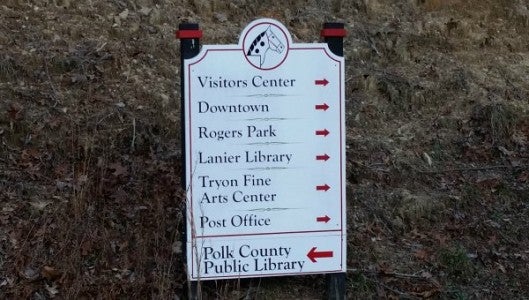 One of the town’s way-finding signs is located across from town hall. 