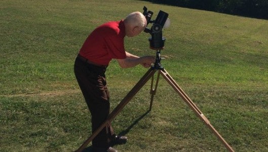 Jesse Willard, star party executive of the Foothills Astronomical Society, sets up his telescope at FENCE.