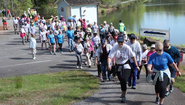 A group of happy PACWalkers begin PACWalk near the lake at Tryon Estates. (Photo by Chris Bartol)
