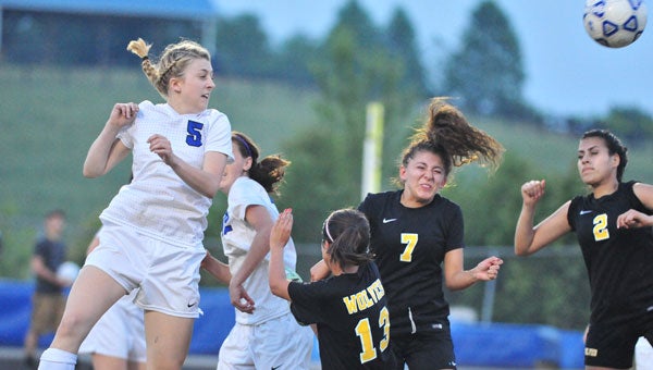Polk County’s Addie Lynch heads the ball on a throw-in near the Lincolnton goal in round one of state playoff action. Polk won the match 3-2, and will meet the winner of Wednesday evening’s West Wilkes/R-S Central match in round two. (photos by Mark Schmerling)