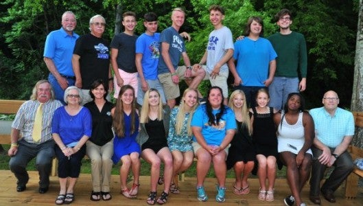 Polk County spring track and field award winning athletes and their coaches took a moment after their May 23 dinner for this photograph. They are, from left; front row: Henry Weaver, Jenny Wolfe, Emma Wagoner, Jessica Bailey, Danielle Holtz, Amanda Simoncic, Savannah Robbins, Anamarie Gunderson, Tameeia Brown, and Scott Harding; Back row: Jim McGrane, Alan Peoples, Nate Smart, Jacob Wolfe, Mitchell Brown, Sean Doyle, Nic Barwell, and Patrick Stimac. (Photos by Mark Schmerling) 