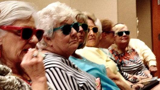 Brightly colored glasses were distributed to attendees which we all decided to wear for Dottie when she appeared.