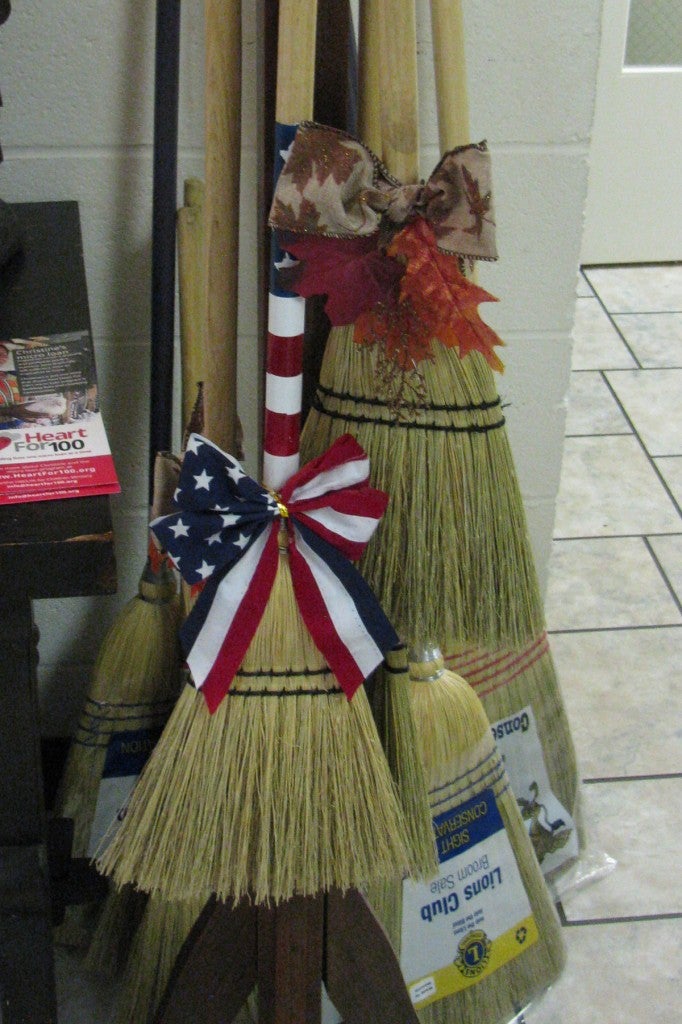 Jim’s decorated brooms.