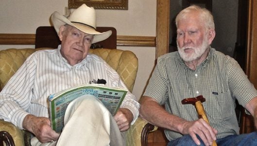 D.M. Wolfe with maps of England and Shetland Islands in his lap, and Hugh Foster (photo by Linda List)