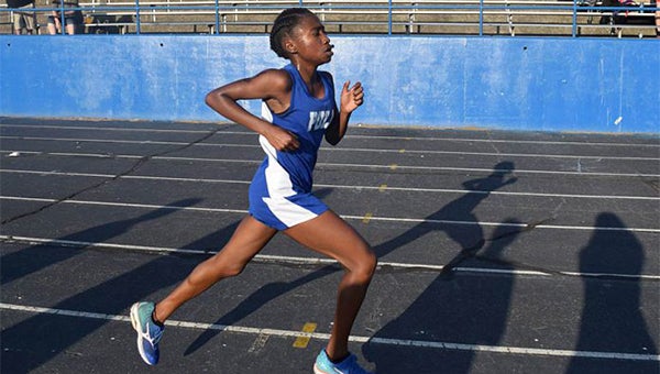 Polk County senior India Godlock won her third Western Highlands Conference cross country title on Thursday.