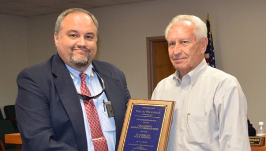 Polk County Manager Marche Pittman recognized outgoing commissioner vice-chair Keith Holbert with a plaque for his service.