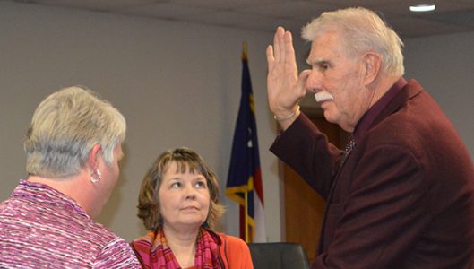 Newly elected commissioner Tommy Melton was sworn into office Monday, Dec. 5 by Polk County Clerk of Superior Court Pam Hyder with his wife Tina. Melton was later appointed chairman of the board.