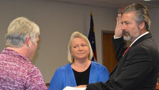 Newly elected commissioner Myron Yoder was sworn into office on Monday, Dec. 5 by Polk County Clerk of Superior Court Pam Hyder with his wife Cornelia.