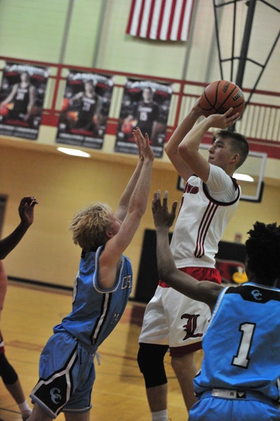 Trey Smith (shooting) has been a spark plug for Landrum's varsity. His hot foul shooting gave the Cardinals breathing room against visiting Christ Church Episcopal on Tuesday.