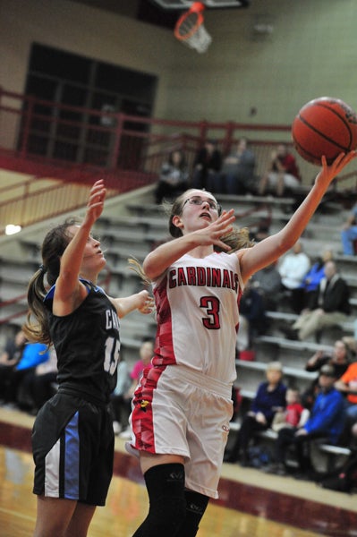 Landrum's Lindsey Hardin (#3, with ball) goes up for a layup early in the Cardinals’ Jan. 17 matchup against Christ Church Episcopal. She's guarded here by the Cavaliers' Paula Pieper. 