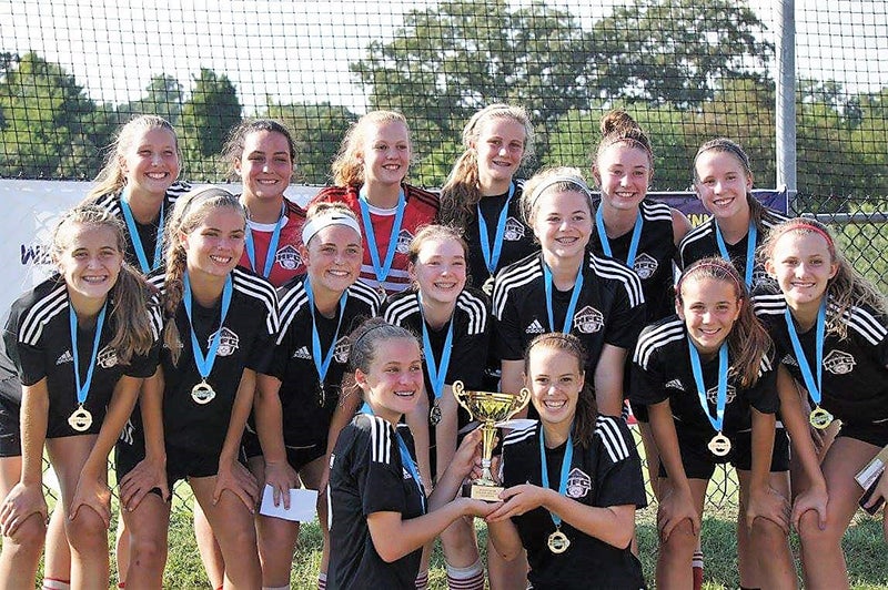 Polk County soccer player celebrates championship win with teammates ...